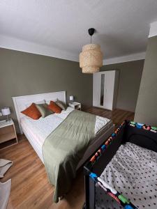 a bedroom with a bed with a crib in it at Sunset Stay in Kolka in Kolka