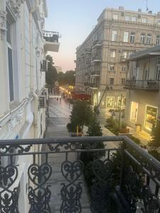 a balcony with a view of a street with buildings at 3 Bedrooms Apartment ın Center in Baku