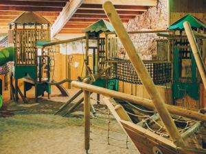 a park with a playground with a slide at Groene Specht 16 in Gramsbergen