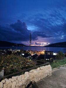 a view of a city at night at Bosiljak in Zelenika