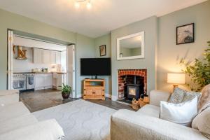 a living room with a tv and a fireplace at 3 Bed in Lydbrook oc-94490 in Lydbrook