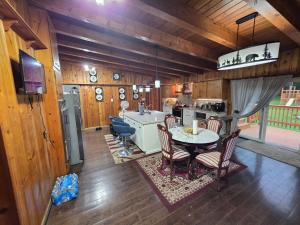 a kitchen and dining room with a table and chairs at A J House in Plano