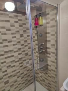 a shower with a glass door in a bathroom at Casa Alcántara in Vilamelle +44 photos