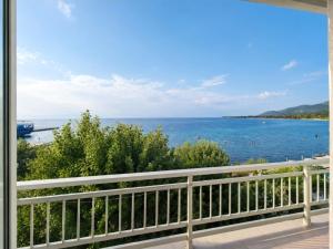 a view of the ocean from a balcony at Hotel Prinos in Skala Prinou