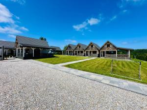 a house with a soccer field in the driveway at Osada Mielenko in Mielenko
