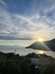 a view of the sun setting over a body of water at Hvar-Zarace Ina 2 in Gdinj