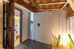 an open door to a room with a hallway at Hotel Qamar in Tulum