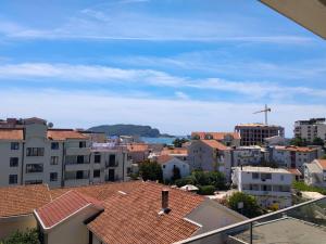 a view of a city from the roofs of buildings at Apartman Vesna in Budva