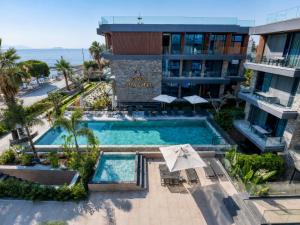 an aerial view of a hotel with a swimming pool at Bodrum Ada Suites Beach Hotel in Turgutreis