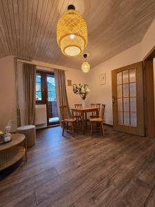 a living room with a table and chairs at LS Apartments Štefanová in Terchová +2 photos
