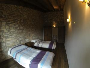 Postel nebo postele na pokoji v ubytování Cal Remolins