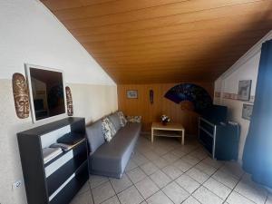 a living room with a couch and a table at Villa LIR in Vir