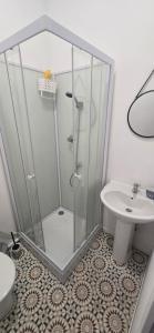 a bathroom with a shower and a toilet and a sink at Olti in Avignon