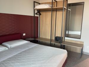 a bedroom with a bunk bed and a mirror at VILLA ACTEA in Vasto
