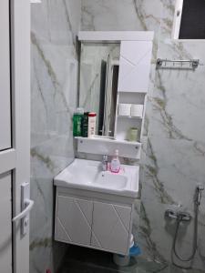 a bathroom with a sink and a mirror at 2-Room Modern House in Naxçıvan +3 photos