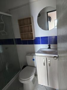 a bathroom with a toilet and a sink and a mirror at Finca Hotel Villa Alba in San Jerónimo +14 photos