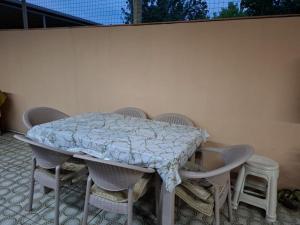 a table and chairs with a blanket on it at 2-Room Modern House in Naxçıvan