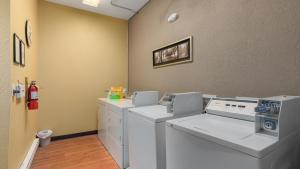 a laundry room with a washer and dryer at Studio Condo Near Lake Pepin - King Bed - Dewdrop in Pepin +11 photos