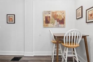 a dining room with a table and two chairs at 4BR Home Across from Como Lake - Evergreen in Saint Paul