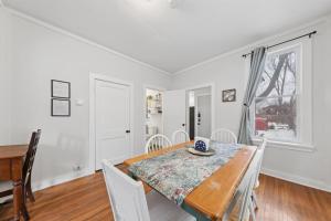 a dining room with a table and chairs at 4BR Home Across from Como Lake - Evergreen in Saint Paul +28 photos