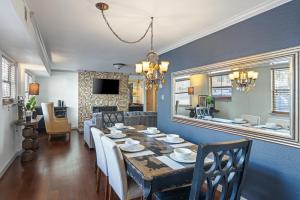 a dining room and living room with a table and chairs at Austin Apartments by Andes STR in Austin
