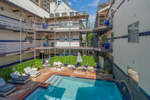 an aerial view of a building with a swimming pool at Austin Apartments by Andes STR in Austin