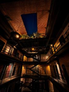a ceiling of a building with a blue light at The Art Hotel El Poblado Medellín By Key 33 in Medellín