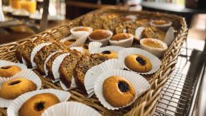 a basket full of donuts sitting on a table at Hotel Boutique Finca La Niebla in Coatepec +96 photos