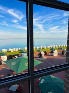 a view of the ocean from a window at Hotel Seerose in Wilhelmshaven