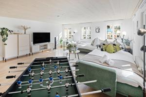 a living room with a chess game on a table at BASEKAMP Prime I Friends I Lake I Mountains I Luzern in Küssnacht