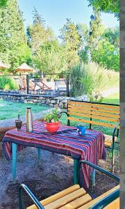 a picnic table with a table cloth on it at Cabañas ConSentidos in Villa General Belgrano