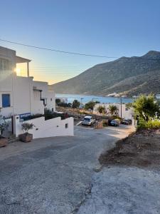 a house with a view of the water at Studios Mirtia in Kamares