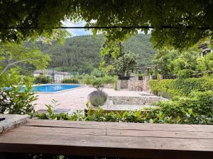 a view of a swimming pool in a garden at Villa Fundemia in Gorna Breznitsa