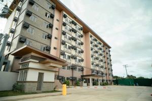 a large building with balconies on the side of it at Linear Space at Soleia Butuan Unit G in Butuan