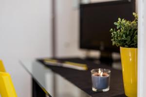 Televízia a/alebo spoločenská miestnosť v ubytovaní Casa Giordano