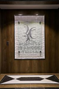 a store window with a sign for a business center at Sandri Palace Hotel in Itajaí +101 photos