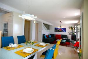 a dining room and living room with a table and chairs at Apartment Allure in Bol