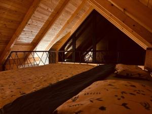 a large bed in the middle of a room at Love Cabin in Slatina Varoš