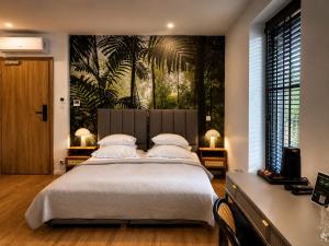 a bedroom with a large bed with white pillows at APARTHOTEL KLEOSIN in Kleosin