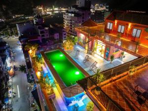 an empty pool in the middle of a city at night at catba new city hotel in Cat Ba
