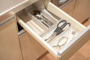 a pair of scissors sitting inside of a drawer at Yukari B in Asahikawa