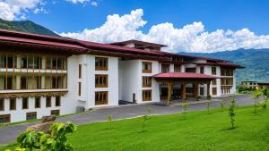 a building with a green lawn in front of it at Terma Linca Paro in Paro