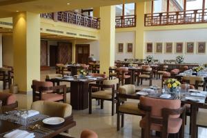 a restaurant with tables and chairs in a room at Terma Linca Paro in Paro