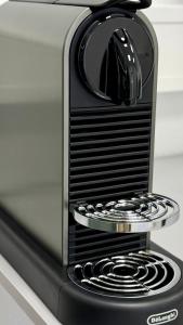 a toaster oven sitting on top of a stove at MeBa Living Business Suite Mönchengladbach in Mönchengladbach