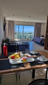 a table with a tray of food on top of it at Arenas del Este in Costa del Este