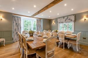 a dining room with a large wooden table and chairs at 11 Bed in Stebbing oc-p34450 in Stebbing