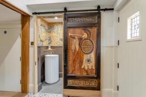 a door in a room with a painting on the wall at 11 Bed in Stebbing oc-p34450 in Stebbing +68 photos