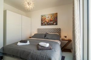 a bedroom with a bed with two towels on it at Villa Oasis mit Meerblick in Supetar +67 photos