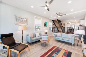 a living room with a couch and chairs and a table at Hidden Cove Unit 6 in Holmes Beach