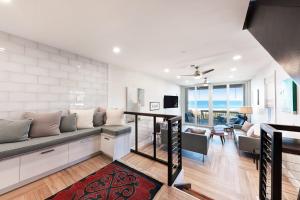 a living room with a couch and a table at Hidden Cove Unit 6 in Holmes Beach